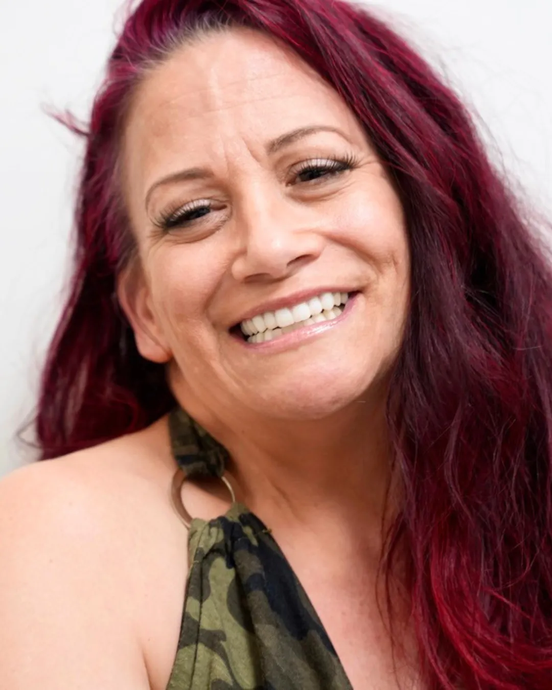 Denise smiling after dental implant treatment