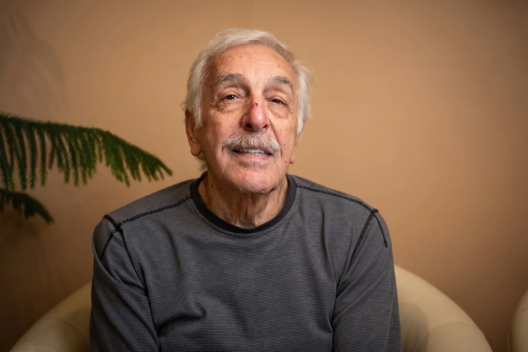 A senior patient smiling in the office
